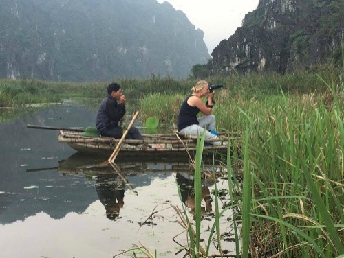 Amanda photographing wildlife in Vietnam