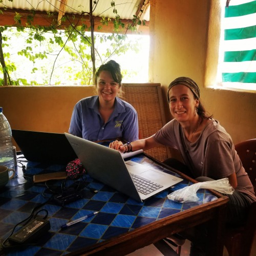 Amanda teaching Mel how to interpret and record data from camera traps